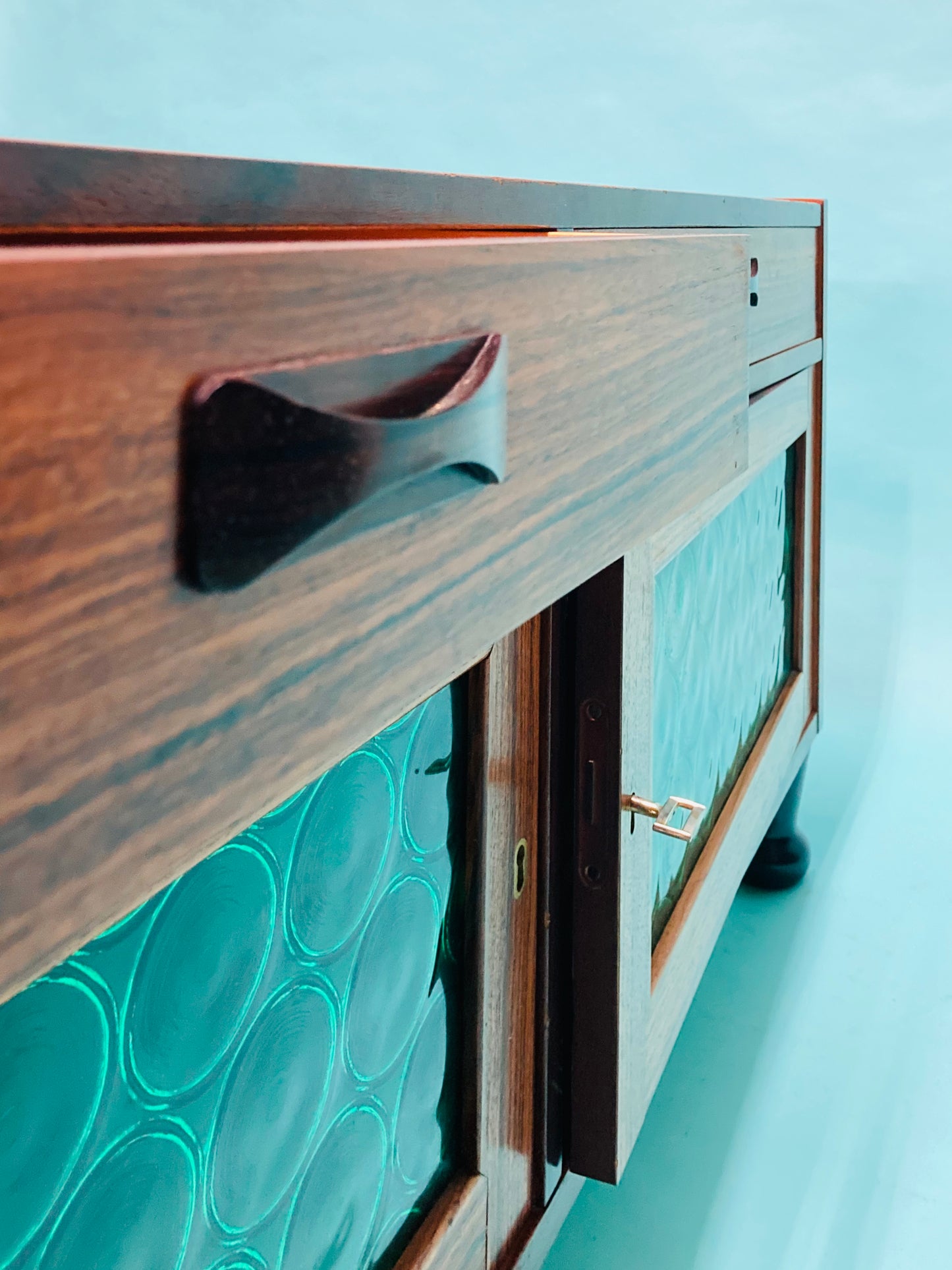 Swedish mid-century  rosewood credenza with glass bottle doors