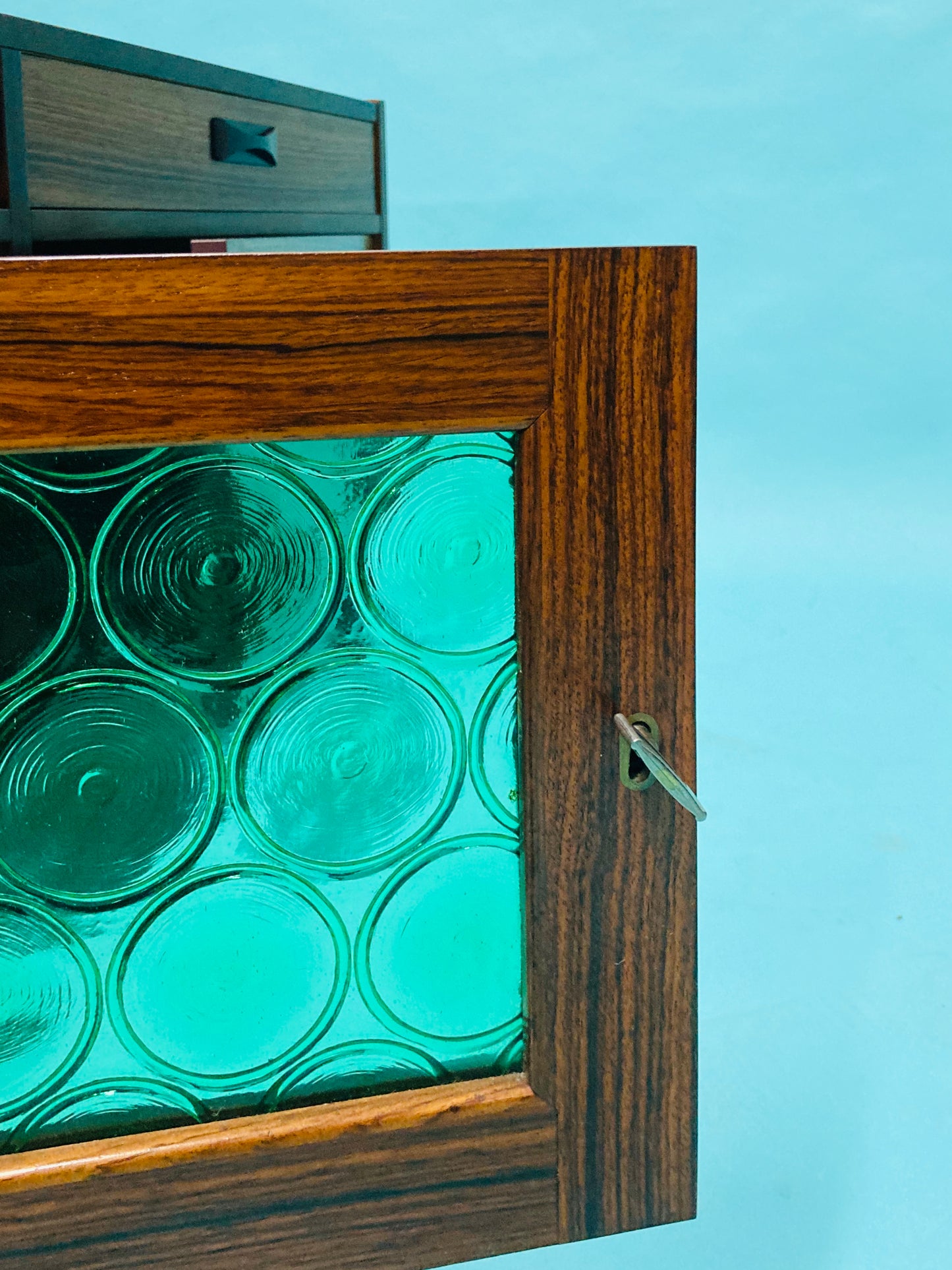 Swedish mid-century  rosewood credenza with glass bottle doors