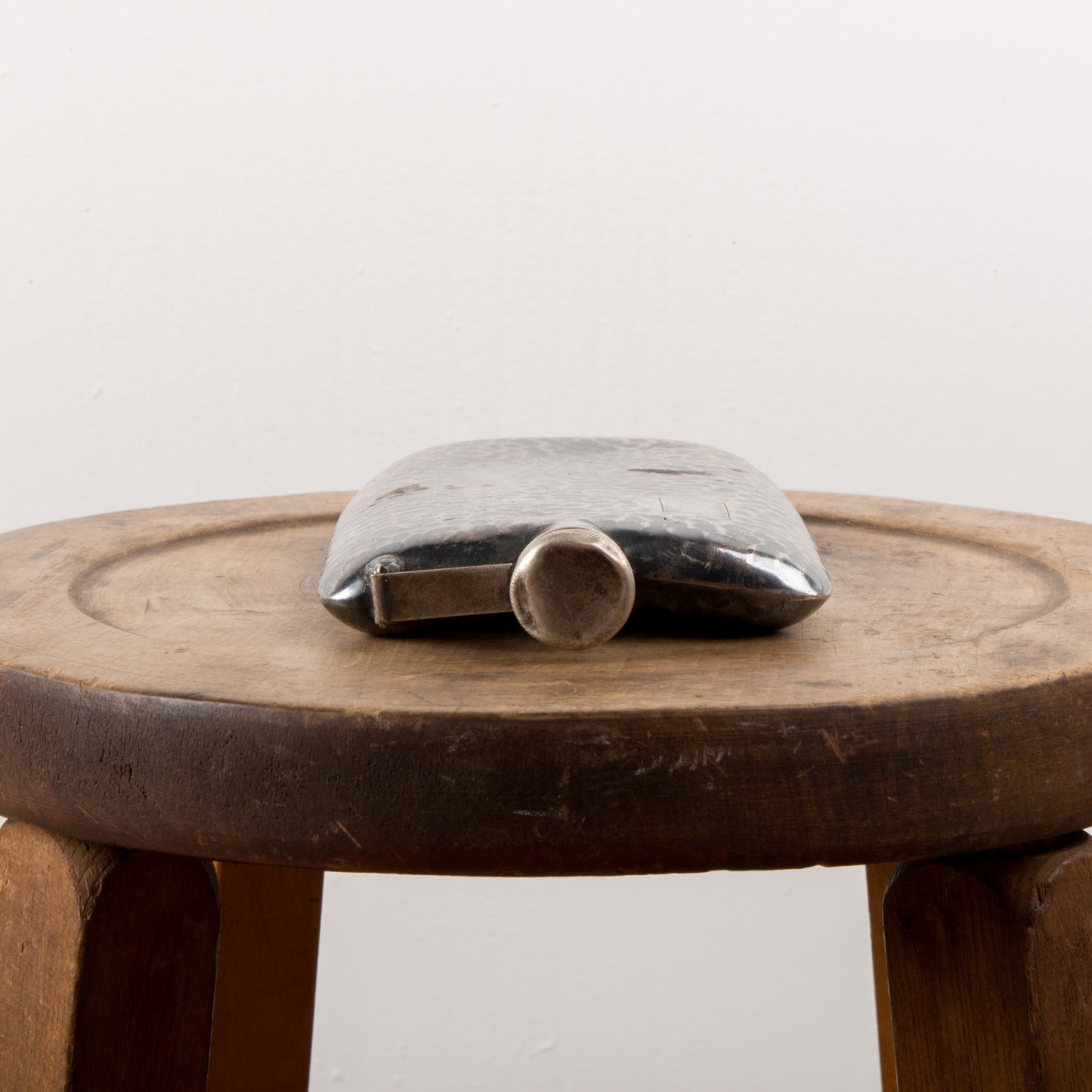 A hammered tin flask