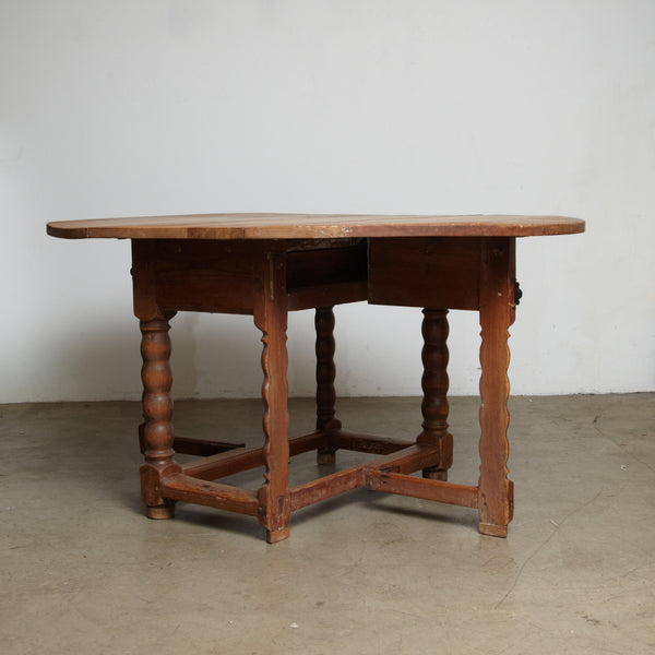 A Danish 18th century Baroque pine drop leaf table