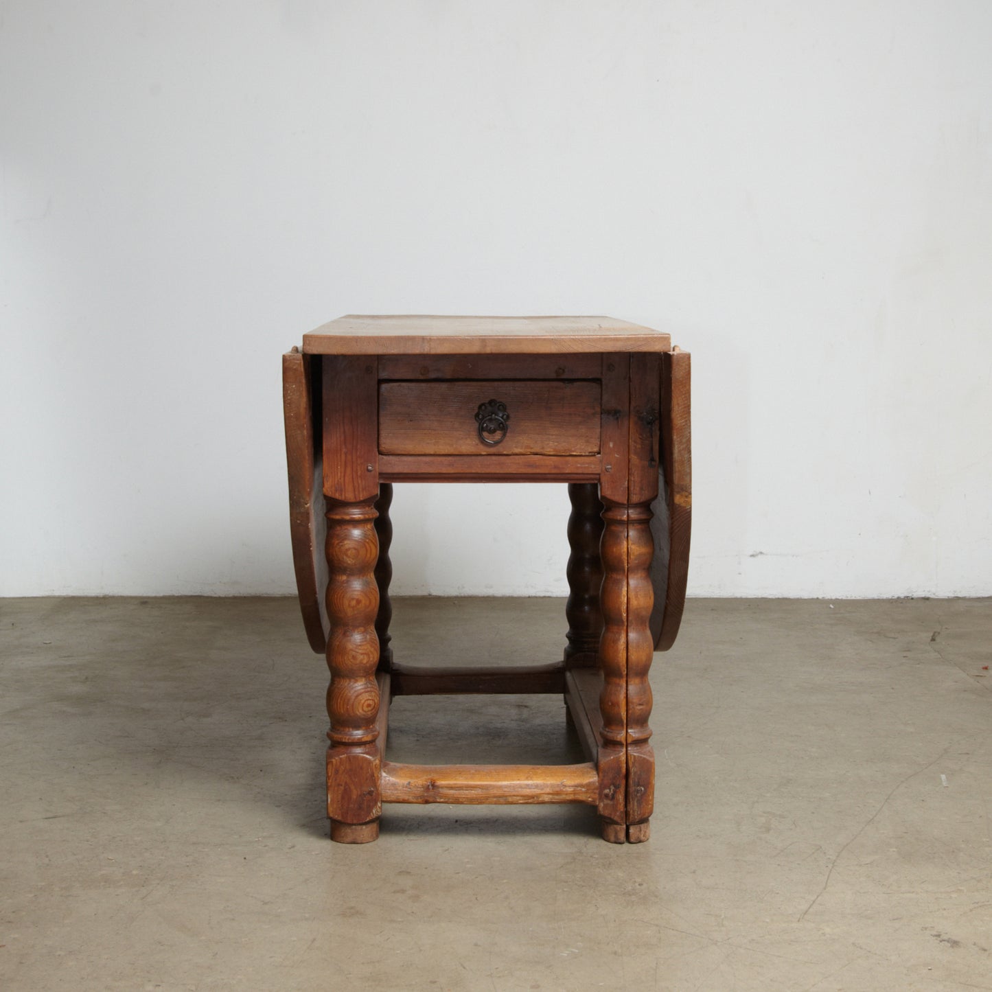 A Danish 18th century Baroque pine drop leaf table